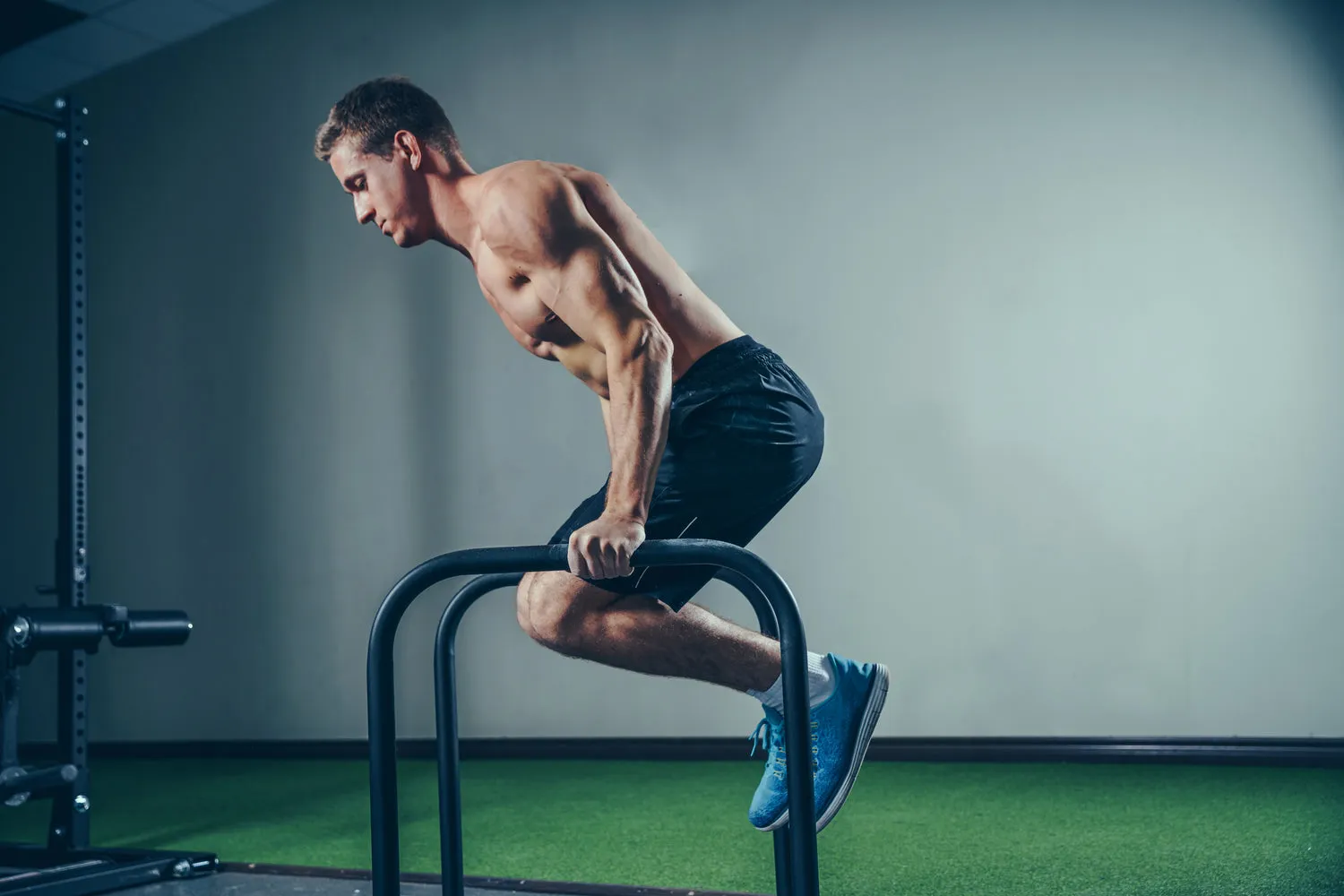 Athlete training on parallel bars